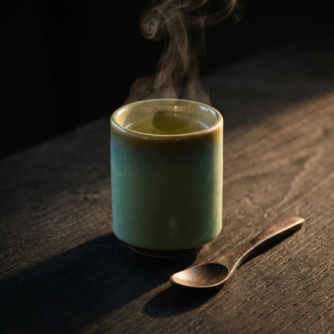 Dipped green Japanese ceramic cup for tea and sake