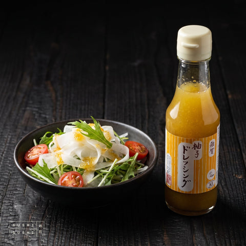 SAIKA Yuzu Dressing 150ml, beside a daikon and mizuna salad