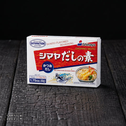 Shimaya, Dashi no Moto Powder, 50g, carton on a charred wood surface