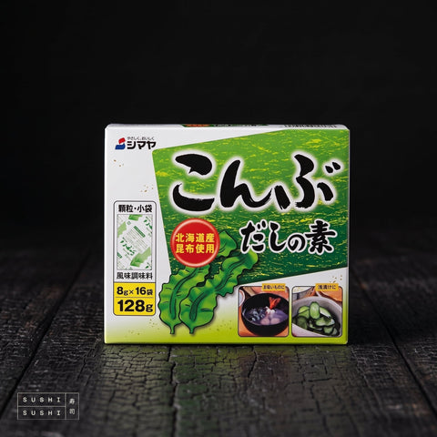 Shimaya, Kombu Dashi Powder, 128g, carton on a charred wood surface