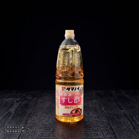 Tamanoi, Sushi Vinegar with Dashi, 1.8L, bottle on a charred shou sugi ban wooden surface against a black background