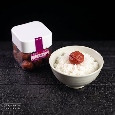 Tencho Umeboshi 120g, with a bowl of rice topped with umeboshi