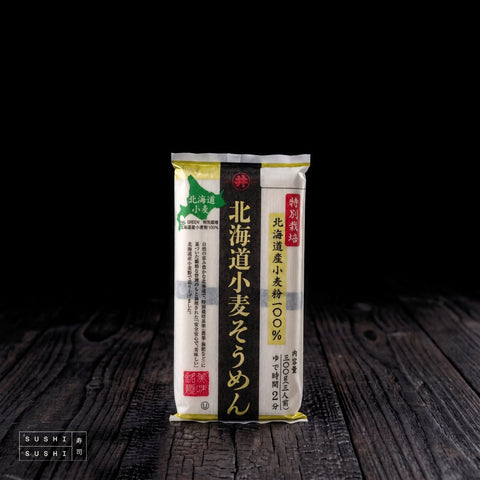 Premium Hokkaido Somen Noodles, 300g, pack on charred shou sugi ban wood against a black background