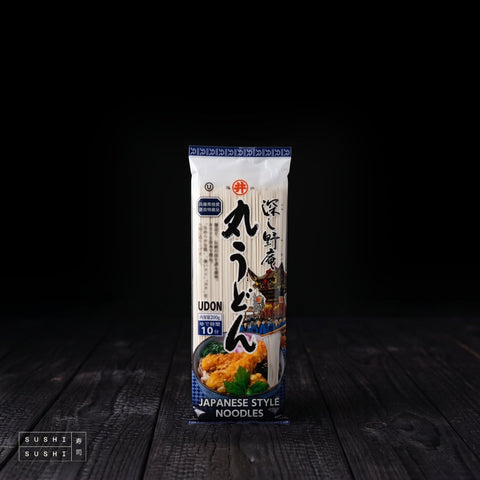 Toa, Maru Udon Noodles, 200g, pack on charred shou sugi ban wood against a black backdrop