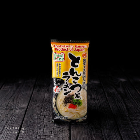 Toa, Tonkotsu Ramen Noodles, 186g, pack on charred shou sugi ban wood against a black background
