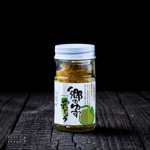 Tosa, Green Yuzu Kosho, 50g, jar on charred shou sugi ban wood against a black background