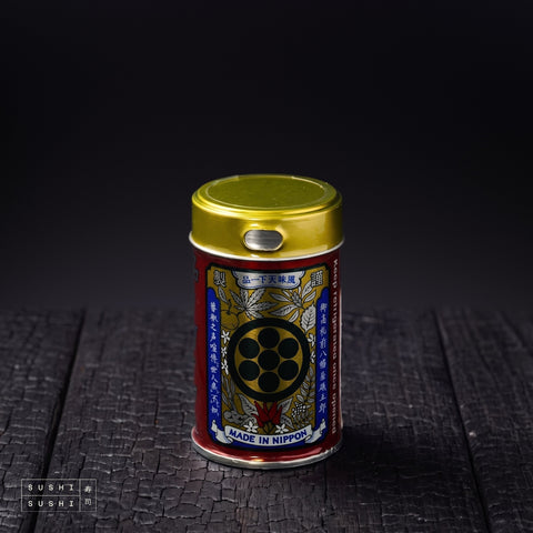 Yawataya, Ichimi Togarashi, 12g, tin on a charred shou sugi ban wooden surface against a black background